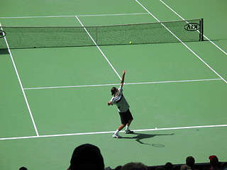 Image showing Roger Federer serving