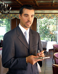 Image showing Maitre D is taking an order