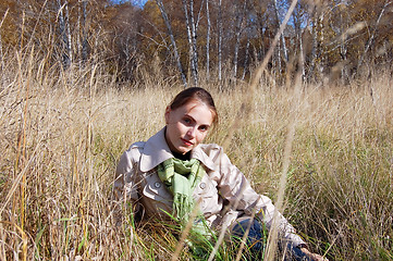 Image showing woman in the grass. autumn day