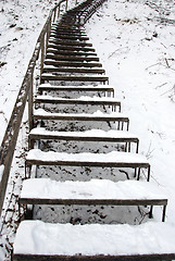 Image showing Stairs covered snow leading steep hill winter 