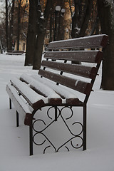 Image showing Empty bench in a winter park
