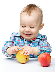 Image showing Little child with apple