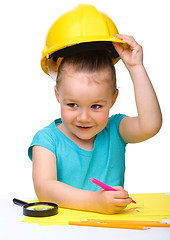 Image showing Cute little girl draw with marker wearing hard hat