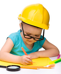 Image showing Cute little girl draw with marker wearing hard hat