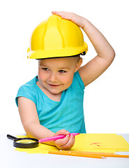 Image showing Cute little girl draw with marker wearing hard hat