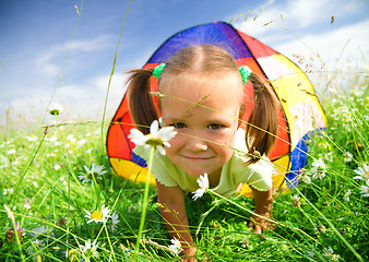 Image showing Girl is playing outdoors under tent