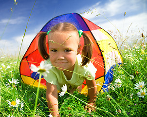 Image showing Girl is playing outdoors under tent