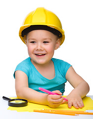 Image showing Cute little girl draw with marker wearing hard hat