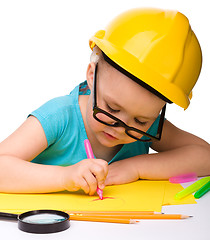 Image showing Cute little girl draw with marker wearing hard hat