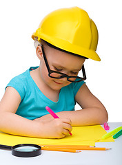 Image showing Cute little girl draw with marker wearing hard hat