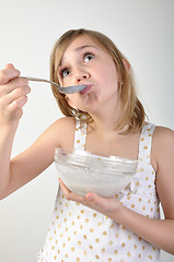 Image showing child eating milk porridge