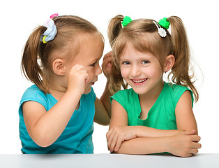 Image showing Two little girls are chatting