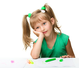 Image showing Cute little girl is tired with drawing