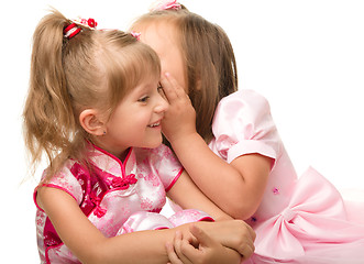 Image showing Two little girls are chatting