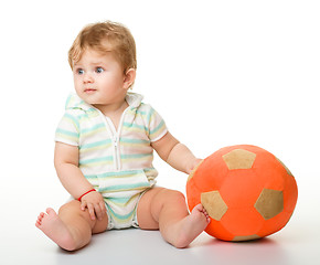 Image showing Cute little child is playing with soccer ball