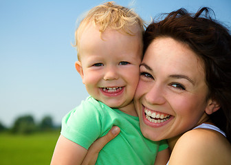 Image showing Child with mother play outdoors