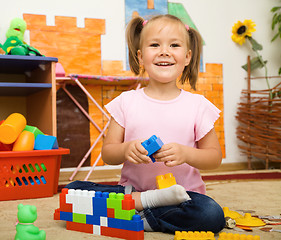 Image showing Little girl is playing with toys in preschool