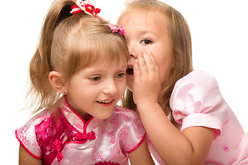 Image showing Two little girls are chatting