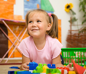 Image showing Little girl is playing with toys in preschool