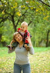 Image showing Mother and her child are playing in park