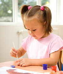 Image showing Little girl is play with paints