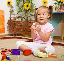 Image showing Little girl is playing in preschool