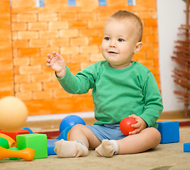 Image showing Little boy is playing with toys in preschool