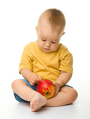 Image showing Cute little boy with red apple