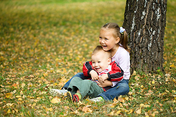 Image showing Children are playing in autumn park