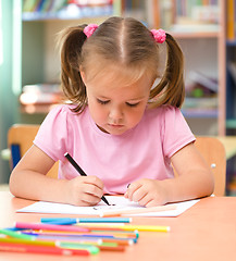 Image showing Little girl is drawing with felt-tip pen