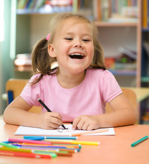 Image showing Little girl is drawing with felt-tip pen