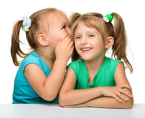 Image showing Two little girls are chatting