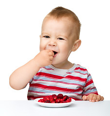 Image showing Cute little boy with strawberries