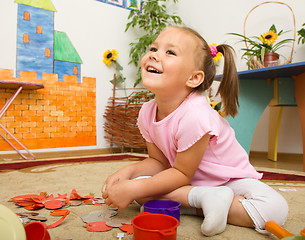 Image showing Little girl is playing in preschool