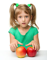 Image showing Portrait of a little girl with apple