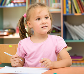 Image showing Little girl is drawing with felt-tip pen