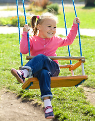 Image showing Cute little girl on swing