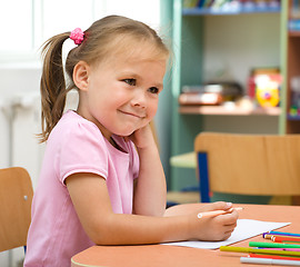 Image showing Little girl is drawing with felt-tip pen