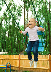 Image showing Cute little girl on swing