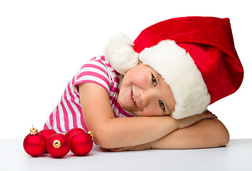 Image showing Cute little girl wearing santa hat