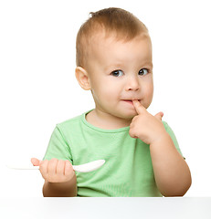 Image showing Cute little boy with spoon