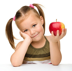 Image showing Little girl with red apple