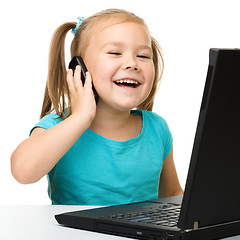 Image showing Little girl with laptop