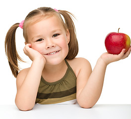 Image showing Little girl with red apple