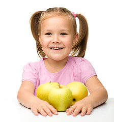 Image showing Little girl with apples