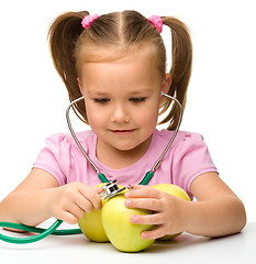 Image showing Little girl with apples