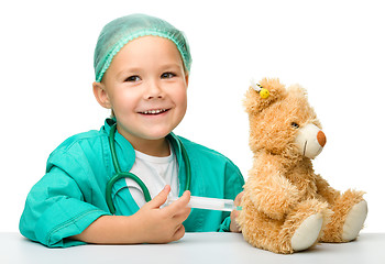 Image showing Little girl is playing doctor with syringe