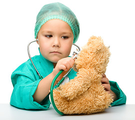 Image showing Little girl is playing doctor with stethoscope