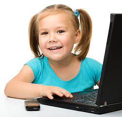 Image showing Little girl with laptop