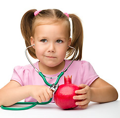 Image showing Little girl with pomegranate